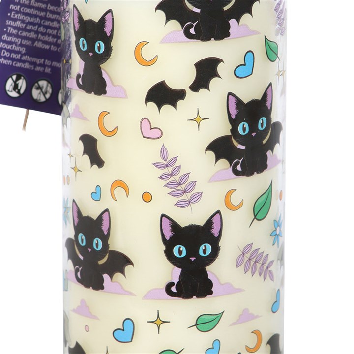 Lavender-scented tube candle with an all-over print of mischievous black cats, moons, hearts and leaves.