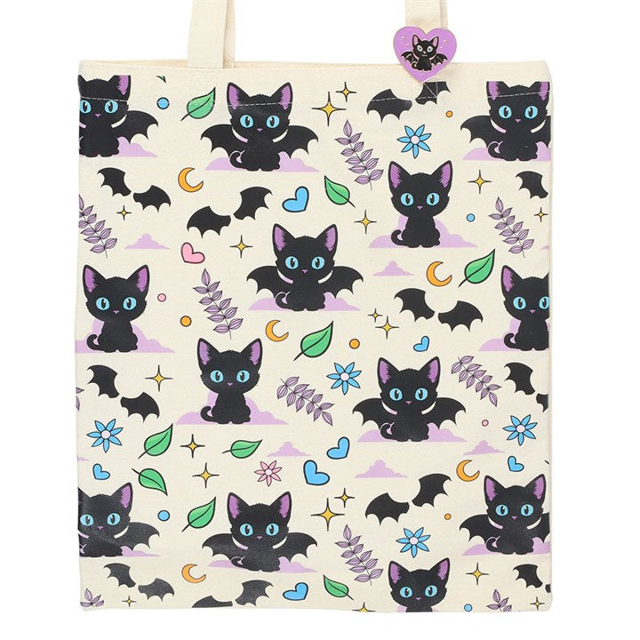 Cute and Creepy Cat Print Polycotton Tote Bag with Enamel Pin features playful black cats and bat wings, perfect for gothic lovers.