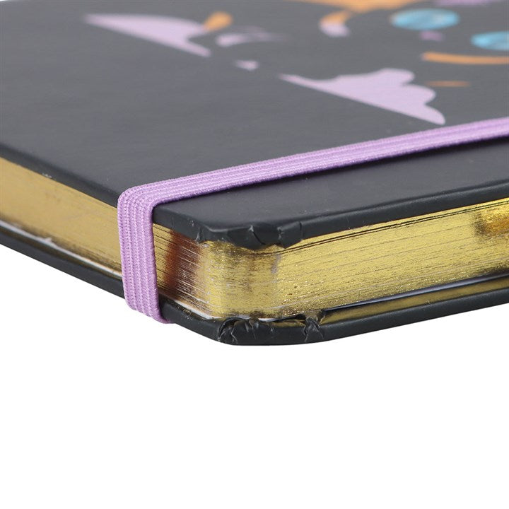 In My Witch Era A5 Notebook with Amethyst Pen, featuring a bat-winged cat design and gold-edged pages.