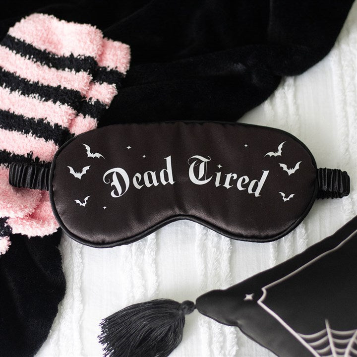 Dead Tired Satin Sleep Mask designed to block light while adding gothic charm to your bedtime routine. Perfect for beauty sleep.