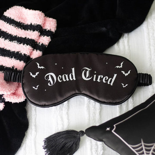 Dead Tired Satin Sleep Mask designed to block light while adding gothic charm to your bedtime routine. Perfect for beauty sleep.