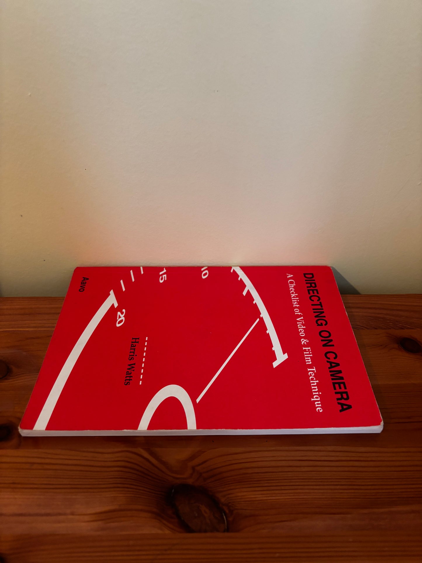 Directing on Camera: A Checklist of Video and Film Technique By Harris Watts displayed on a wooden surface.