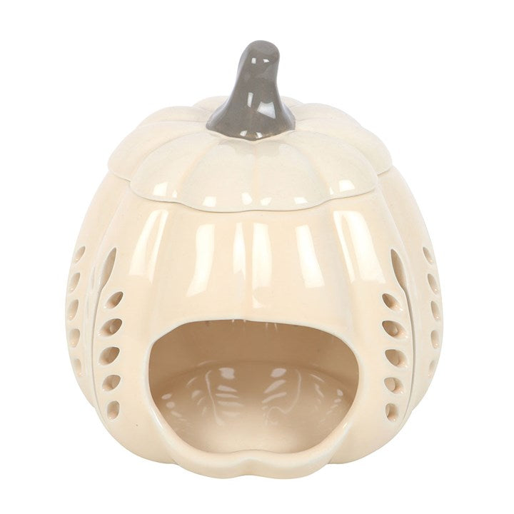 Elegant cream pumpkin oil burner and wax warmer with leaf cut outs, perfect for cosy autumn evenings.
