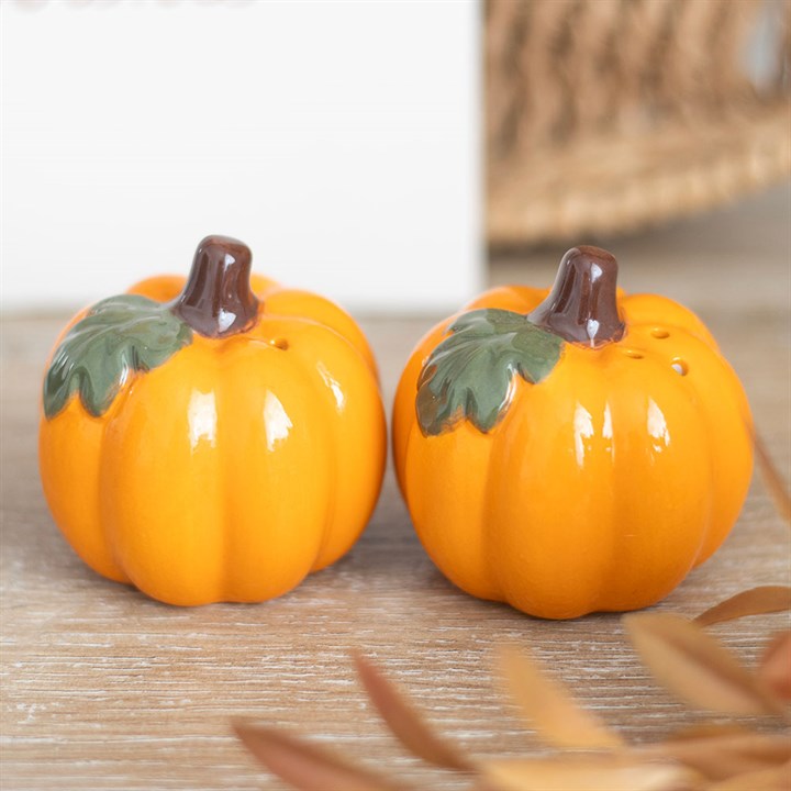 Cute ceramic Pumpkin Salt and Pepper Shakers, perfect for autumn table settings and Halloween decor.