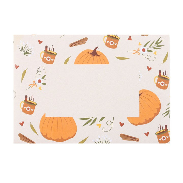 Gold-toned pumpkin necklace on an autumn greeting card with pumpkin and mug border; includes matching envelope.