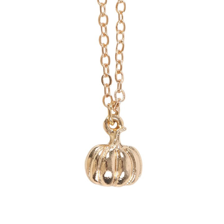 Gold-toned pumpkin pendant necklace on a delicate chain.