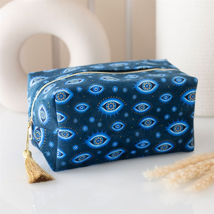All Seeing Eye Print Velvet Makeup Bag in dark blue velvet with celestial eye pattern and gold-tone tasselled zip.