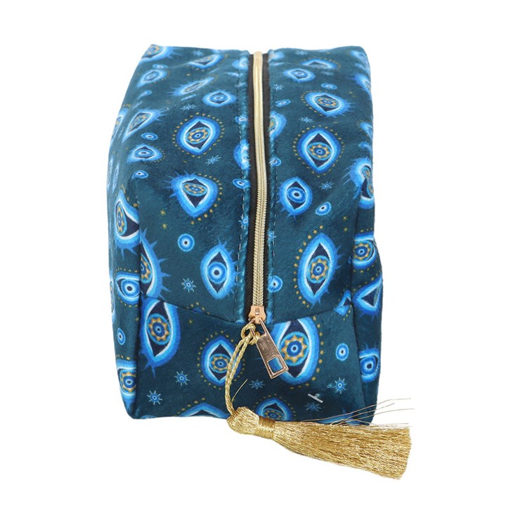 All Seeing Eye velvet makeup bag in dark blue with celestial eye print, stars, and gold-tone zip tassel.
