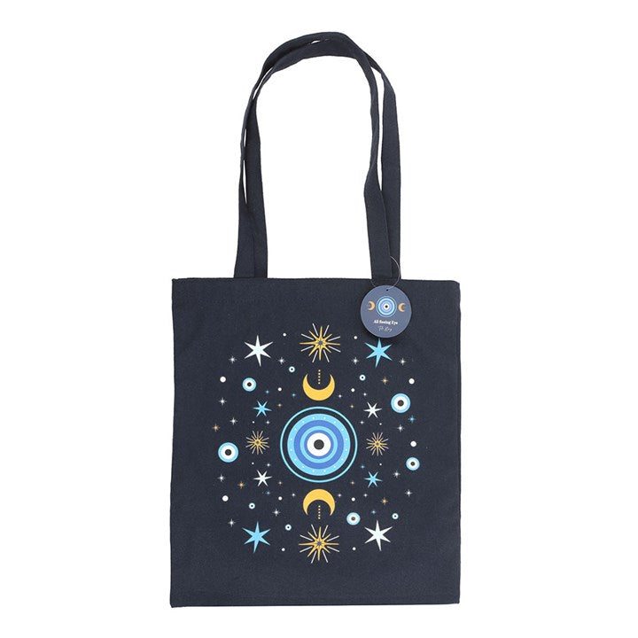 Dark blue All Seeing Eye Polycotton Tote Bag featuring crescent moon and star accents, perfect for stylish errands.
