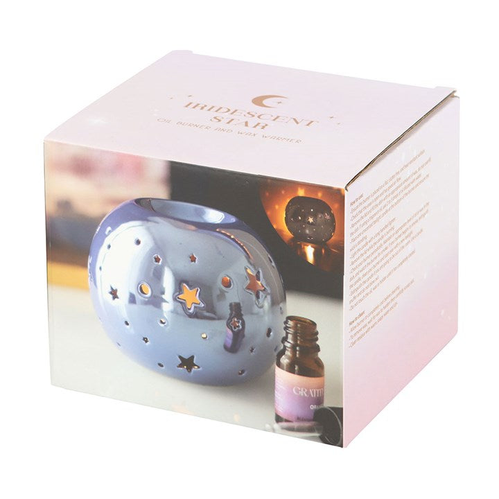 Purple Iridescent Star Oil Burner and Wax Warmer adds mystic charm with a radiant glow and star cut-outs, enhancing any space.