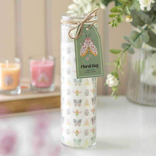 Floral Bug Garden Rose tube candle with pastel butterfly motifs, green tag and twine bow.