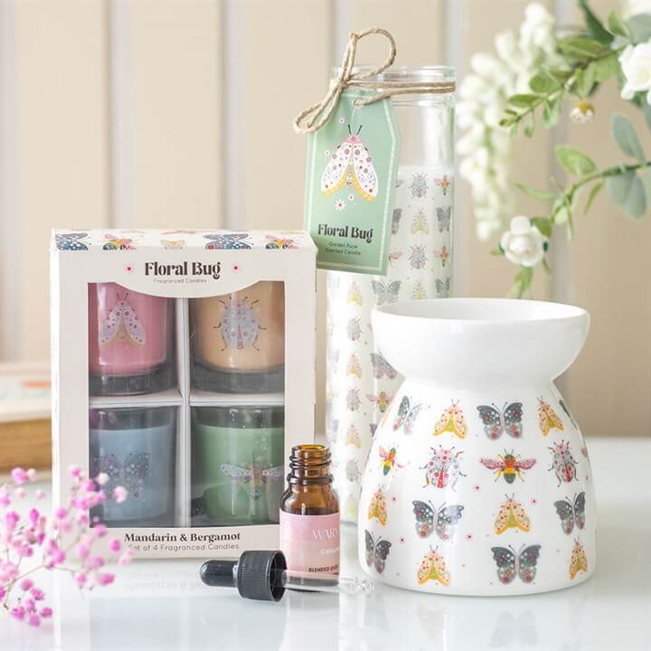Floral Bug Garden Rose Tube Candle with pastel floral bug design, boxed four-colour candles and ceramic vase.