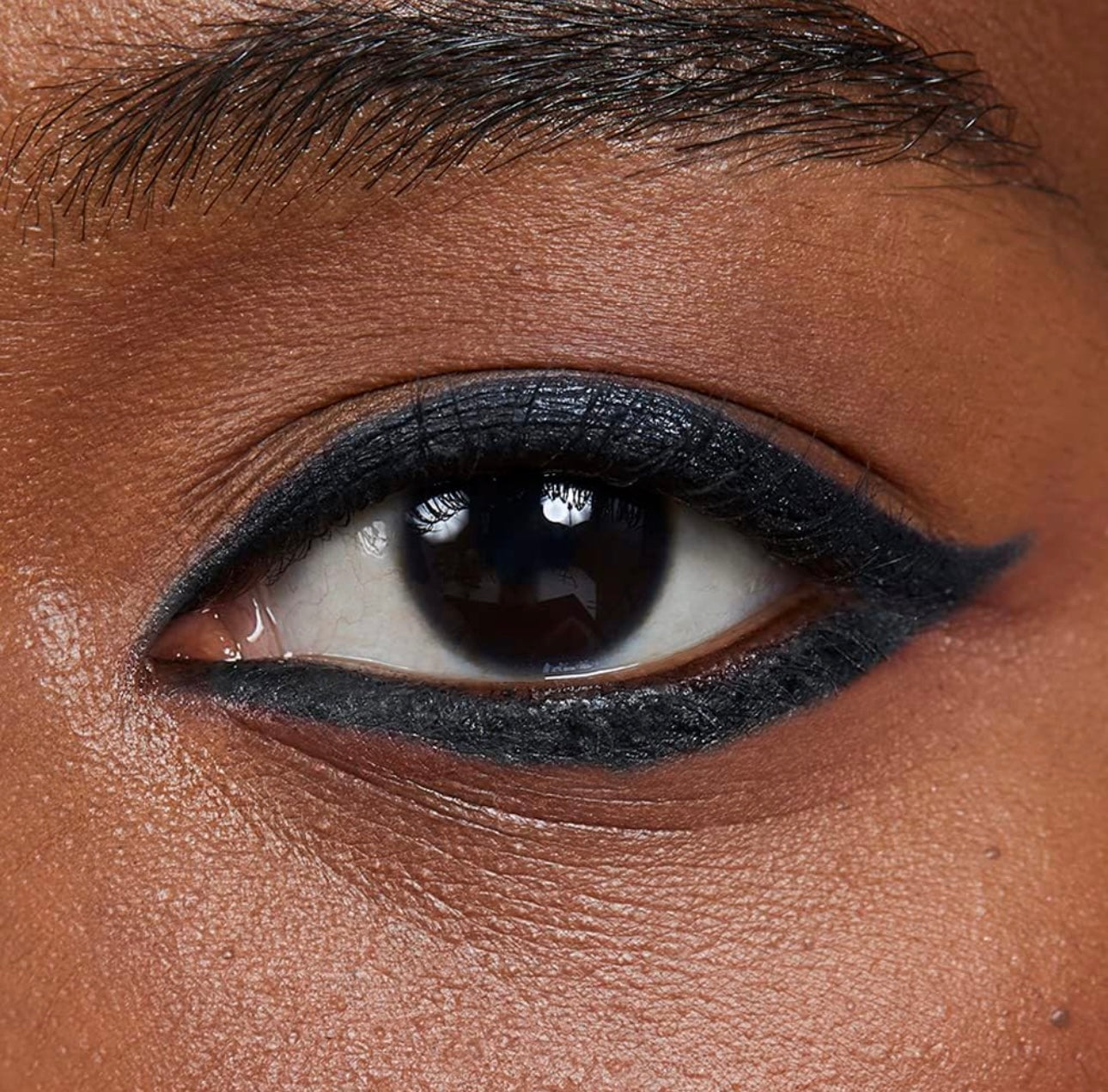 Enhance your look with the Avon Diamond GlimmerStick Eyeliner in "Black Ice," showcasing bold, glamorous eye makeup.