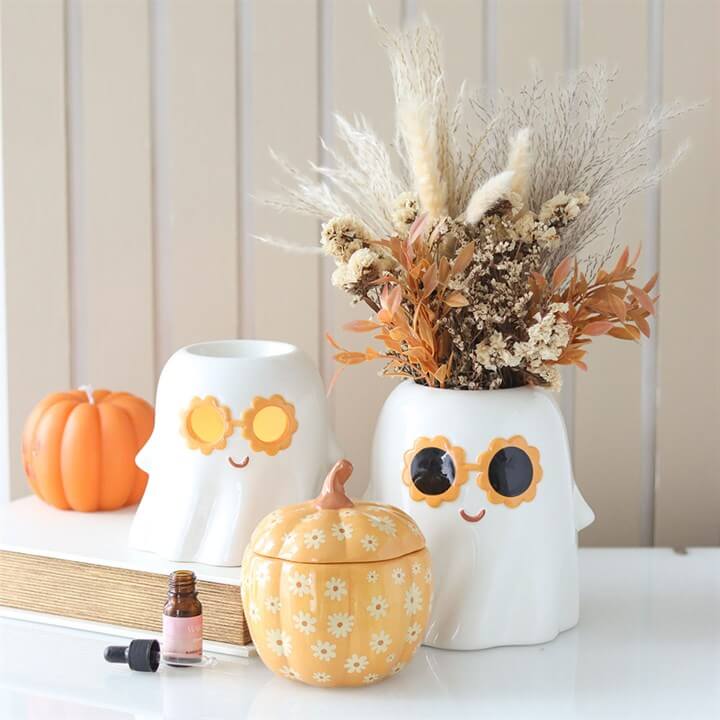 Ceramic Groovy Ghost Vase with 60s sunglasses, perfect for autumn decor and displaying seasonal flowers.