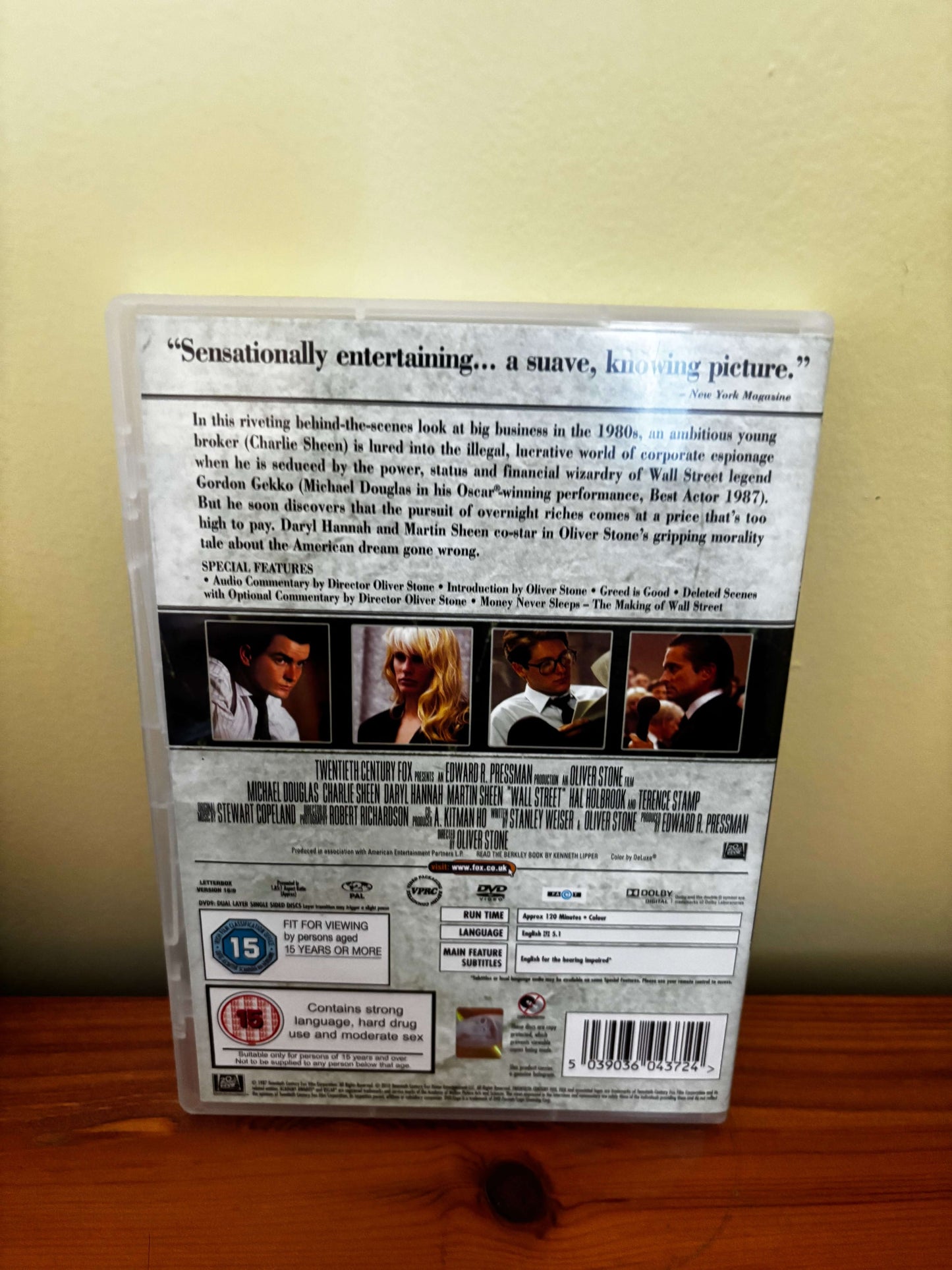 DVD case with text and images on a wooden surface