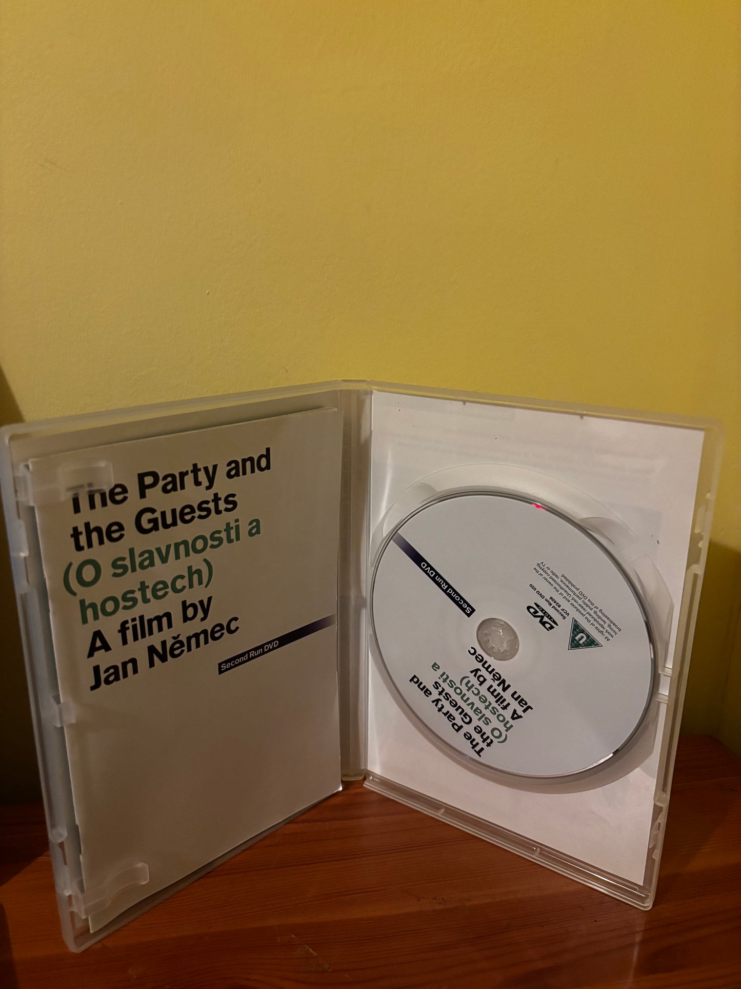 Open DVD case for The Party and the Guests by Jan Němec (1966), disc visible on right.