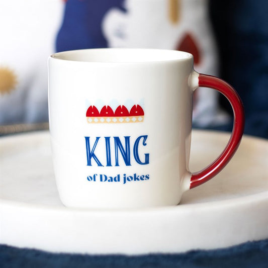 White King of Dad Jokes Mug with red handle and crown design, perfect for pun-loving dads. Ideal gift from your store.