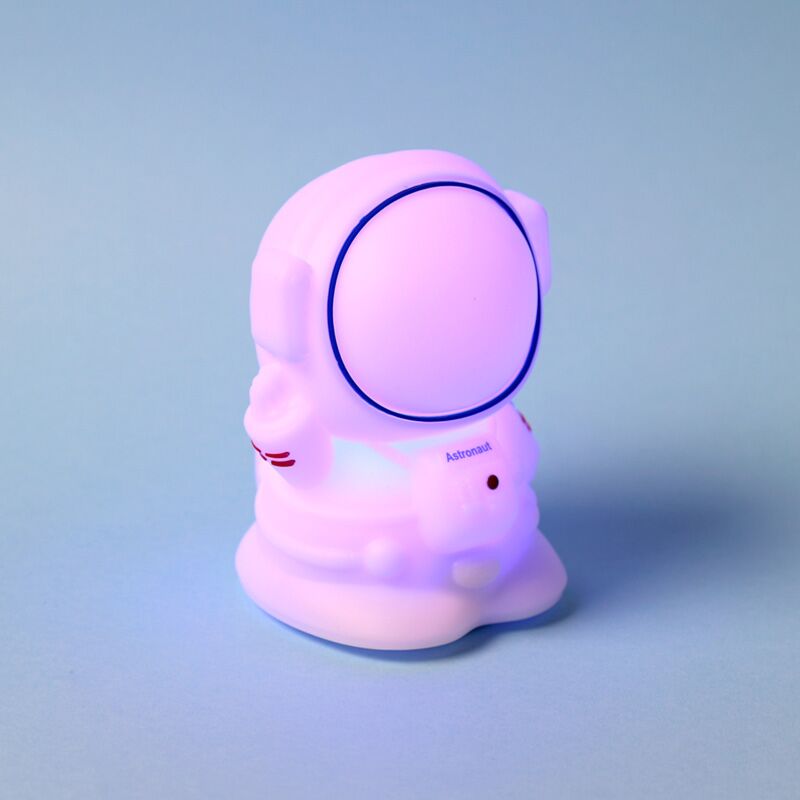 Colour-changing Space Cadets Astronaut sleep lamp, silicone night light with USB-C recharge and purple glow.