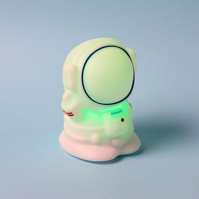 Space Cadets Astronaut colour-changing sleep lamp, silicone night light glowing green