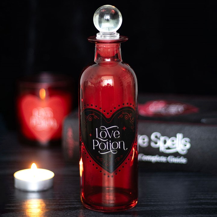 Decorative Glass Love Potion Bottle with a heart design, perfect for enchanting gifts or home decor at Mystic Treasures.