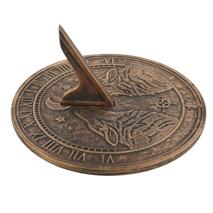 Howling Wolves Terracotta Sundial by Lisa Parker showcases a rustic bronze finish with an intricate wolf design, ideal for gardens.