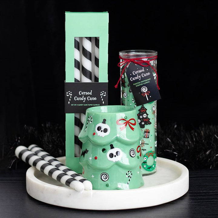 Merry Creepmas Cursed Candy Cane Tube Candle displayed with mint packaging and striped black-and-white candles.