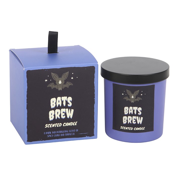 Bat's Brew Clove and Tobacco Candle – purple jar with black lid beside Bat's Brew box, dark clove and tobacco scent.