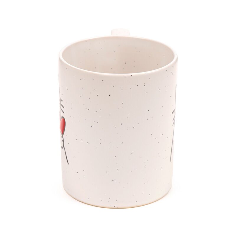 Stoneware mug with speckled glaze featuring a cat with heart design on the side.