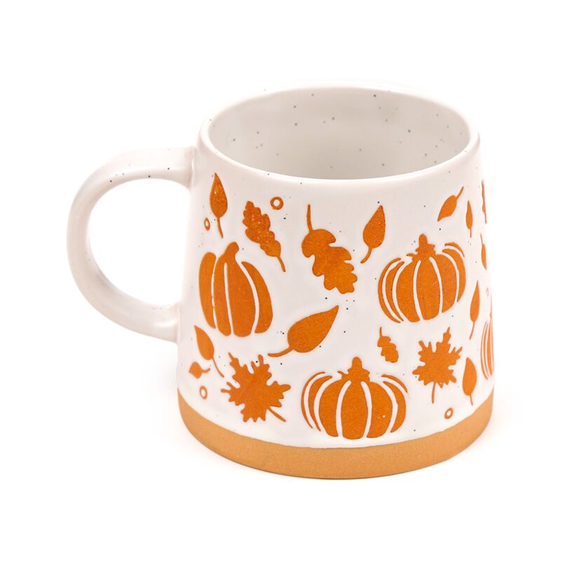 Stoneware mug adorned with orange pumpkin and leaf motifs on white ceramic, autumnal Halloween design.