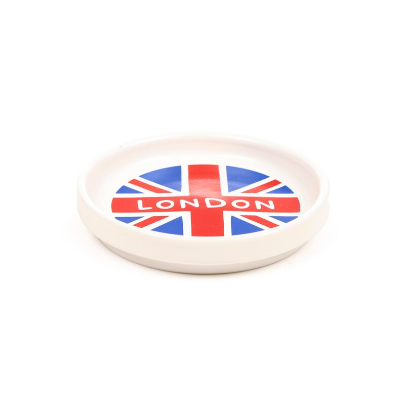 Porcelain coaster lid featuring Union Jack and LONDON, from a London Guardsman mug set.