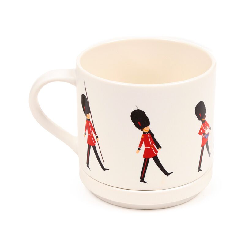 Porcelain mug featuring a London Guardsman motif; redcoat guardsmen wrap around a white mug.