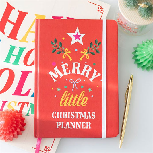 Merry Little Christmas Planner on a festive surface, perfect for organising holiday tasks and gift lists.