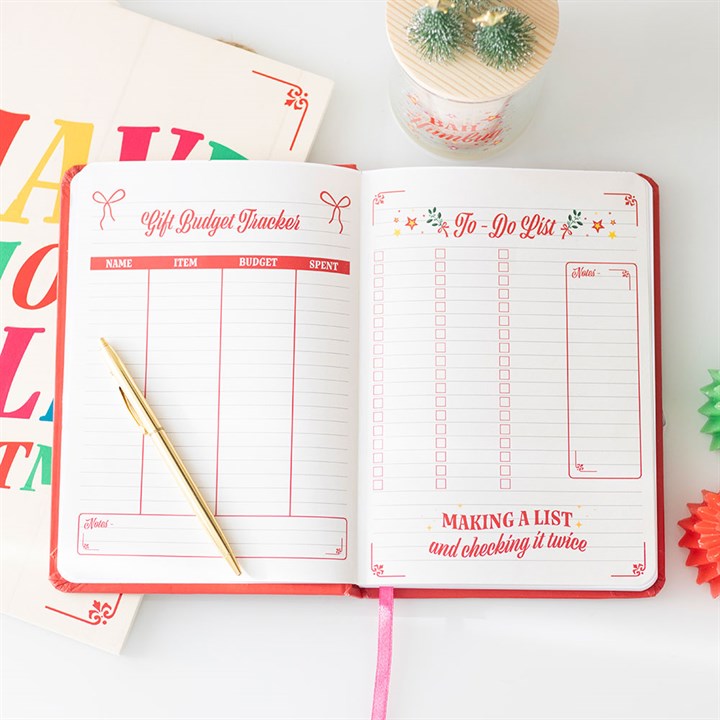 Merry Little Christmas Planner open with sections for gift budgets and to-do lists, perfect for festive organisation.