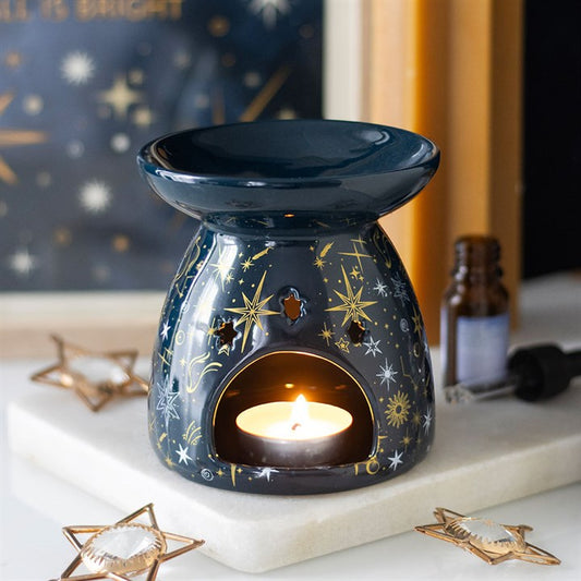 Blue Starry Night Oil Burner and Wax Warmer ceramic burner with celestial starry pattern and a lit tea-light.