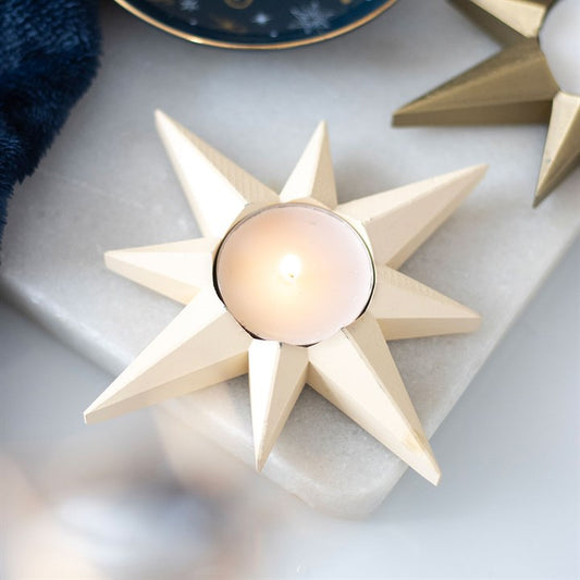 Illuminate your home with the Cream Star Tealight Candle Holder, perfect for festive gatherings and celestial décor.