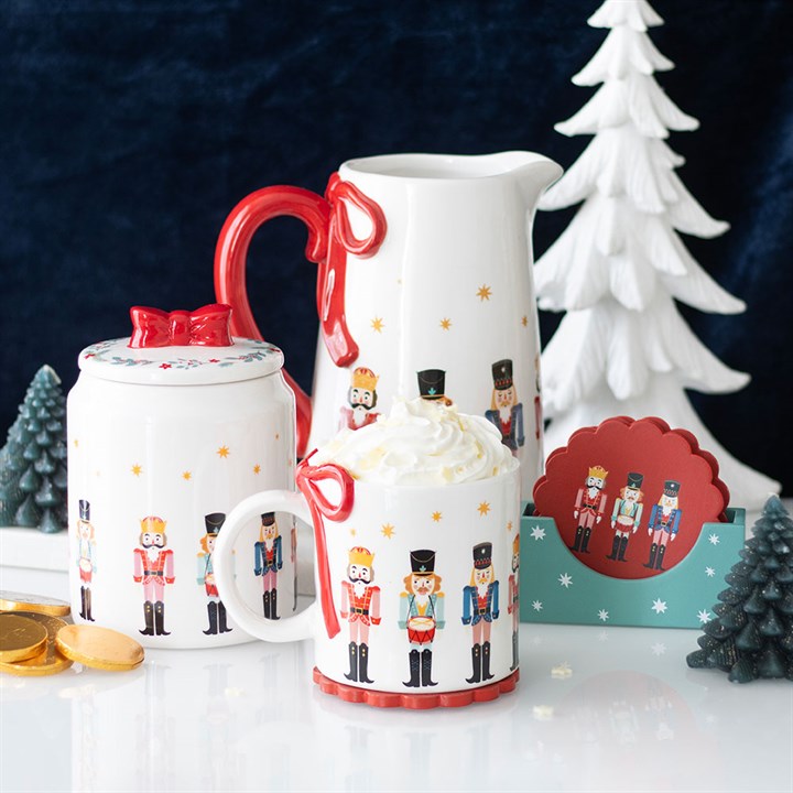 Festive Nutcracker Print Mug with Bow, perfect for cosy drinks by the fire this winter season. Ideal for holiday cheer!