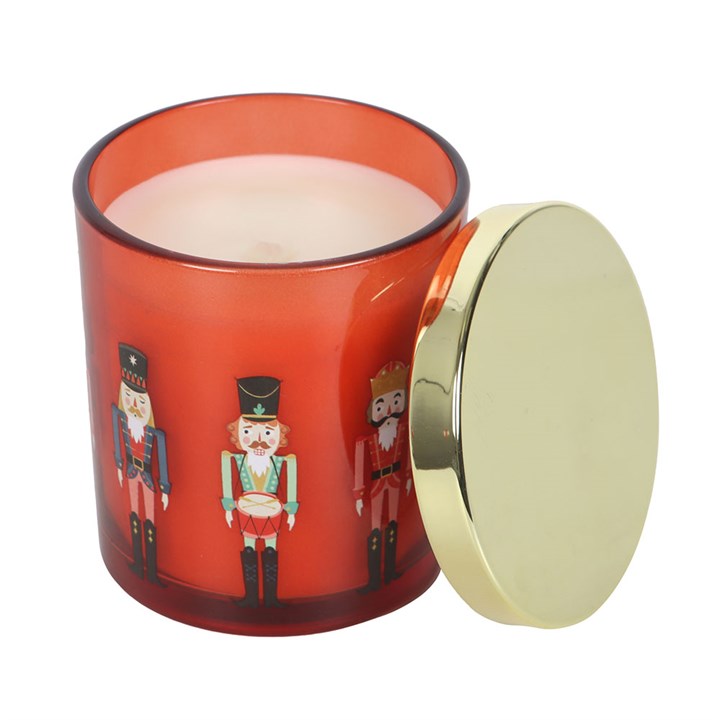 Nutcracker Festive Spice Candle in a vibrant jar, featuring a charming nutcracker design and a gold-tone lid.