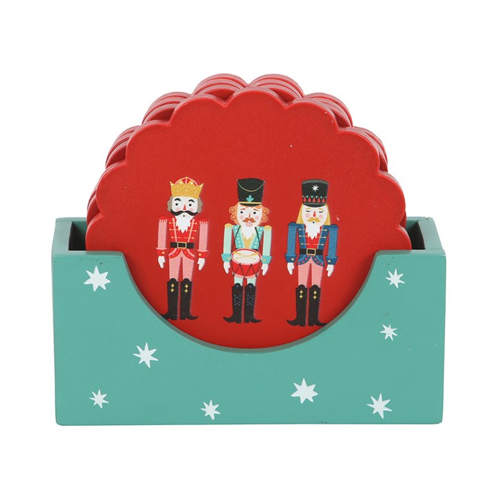 Nutcracker Coaster Set featuring four festive red coasters with scalloped edges and a matching holder. Perfect for Christmas.