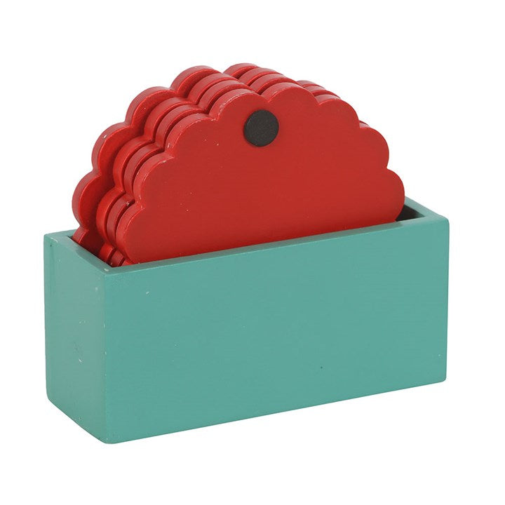 Nutcracker Coaster Set in festive red, featuring a scalloped design and holder, perfect for holiday coffee tables.