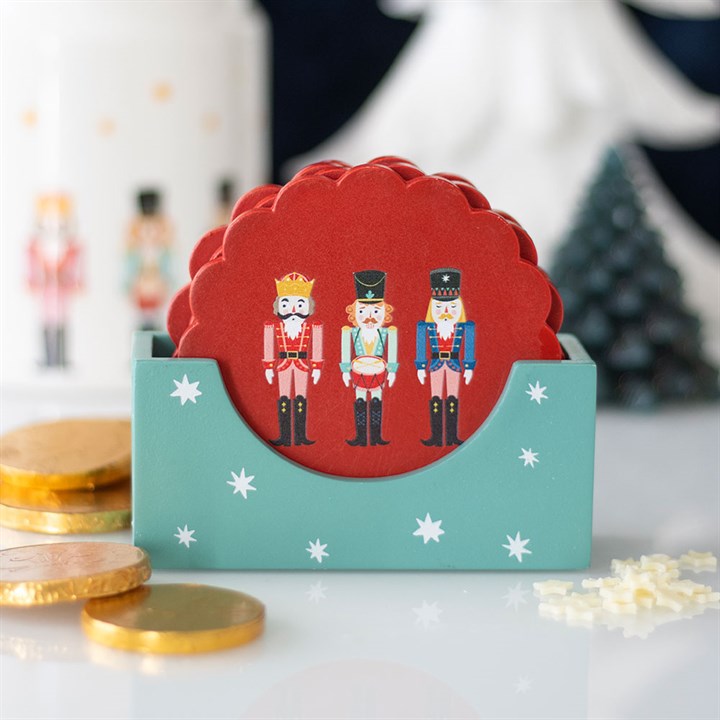 Nutcracker Coaster Set in festive red, featuring charming nutcracker designs and a stylish holder for Christmas cheer.