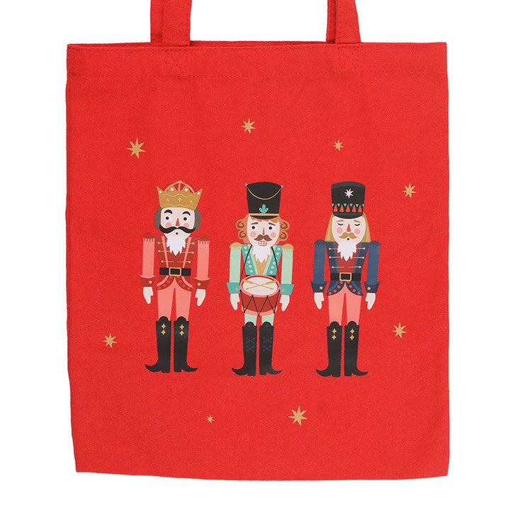 Bright red Nutcracker Print Polycotton Tote Bag featuring festive nutcracker design, perfect for Christmas shopping.