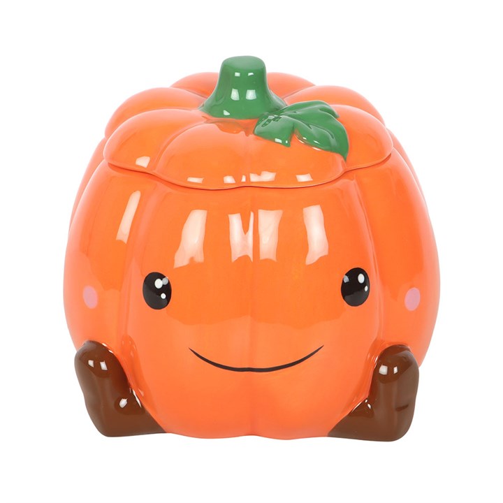 Cute ceramic pumpkin oil burner and wax warmer with a smiling face, star cut-outs, removable lid and green stem.