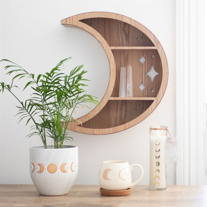 Wooden Crescent Moon Wall Shelf showcasing crystals and plants, a whimsical addition to your home decor. Perfect for treasures!