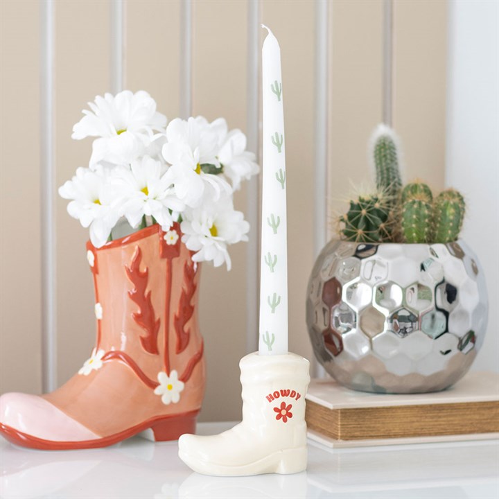White Cowboy Boot Candle Holder with Taper Candle adds Western charm, featuring a boot design and fun cactus motif.