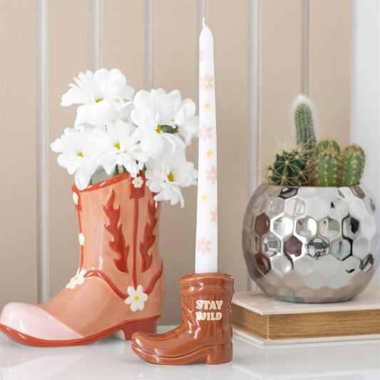 Brown Cowboy Boot Candle Holder with Taper Candle adds Western charm, featuring a floral taper in a stylish boot design.