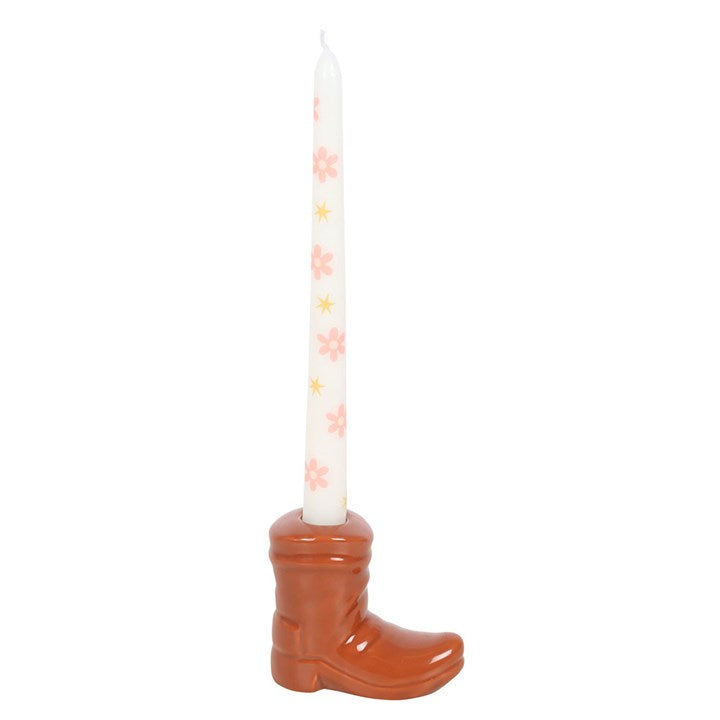 Brown Cowboy Boot Candle Holder with Taper Candle adds Western charm with a floral taper in a classic boot design.