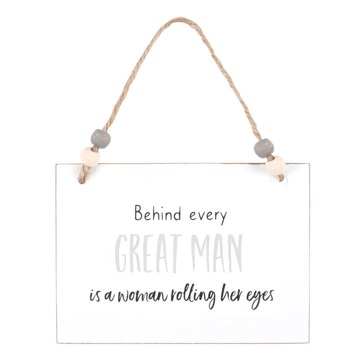 Behind Every Great Man Hanging Sign, a witty white wooden hanging sign with the line about a woman rolling her eyes.