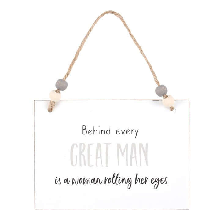 Behind Every Great Man Hanging Sign, a witty white wooden hanging sign with the line about a woman rolling her eyes.