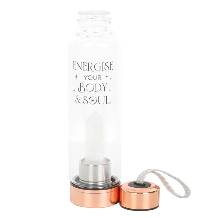 Clear Quartz Body and Soul Glass Water Bottle featuring a quartz crystal inside a glass bottle with a rose-gold base.