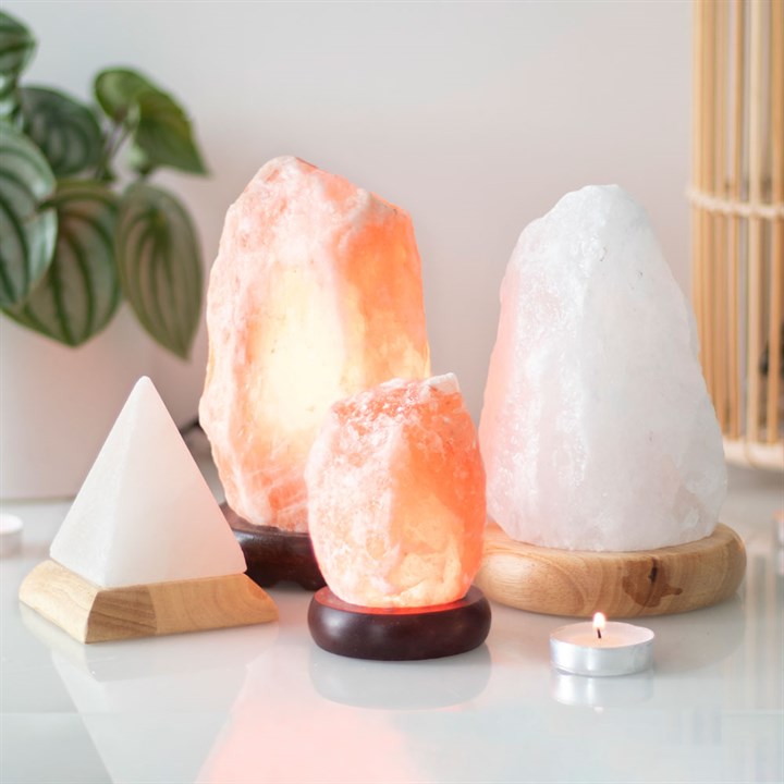 Himalayan 1.5-2Kg Salt Aroma Lamp emitting a warm glow, perfect for enhancing your space with fragrance.